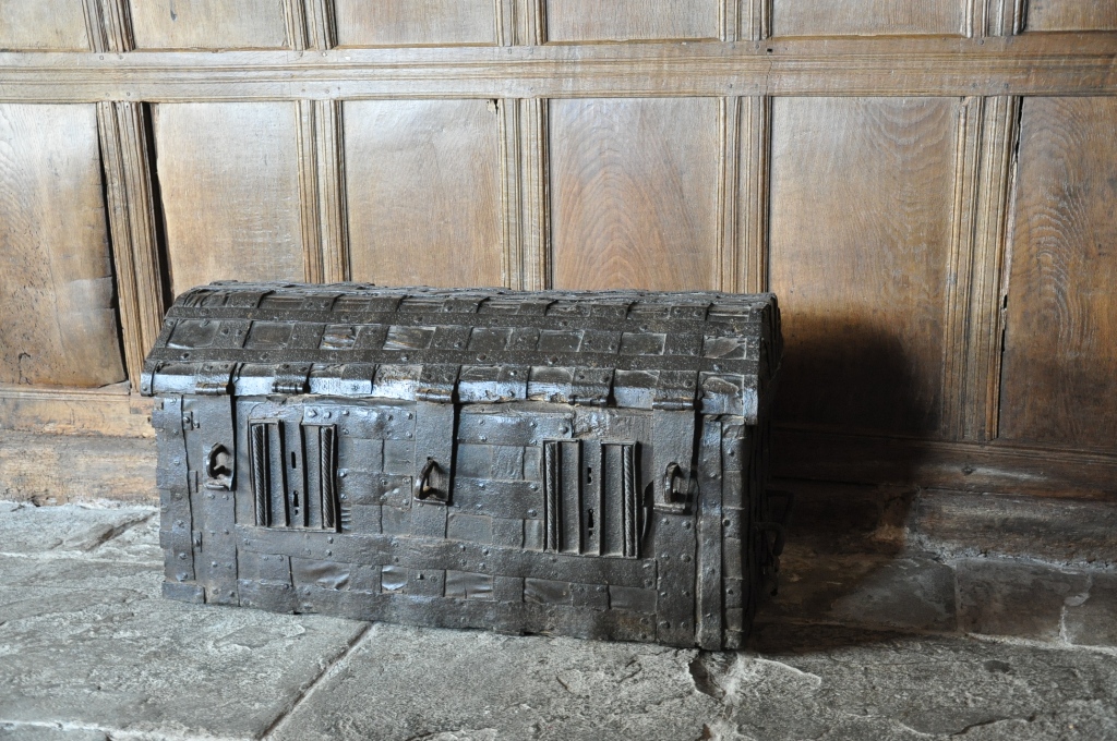 AN OUTSTANDING EARLY 15TH CENTURY ENGLISH ELM IRONBOUND AND LEATHER STANDARD. CIRCA 1400.