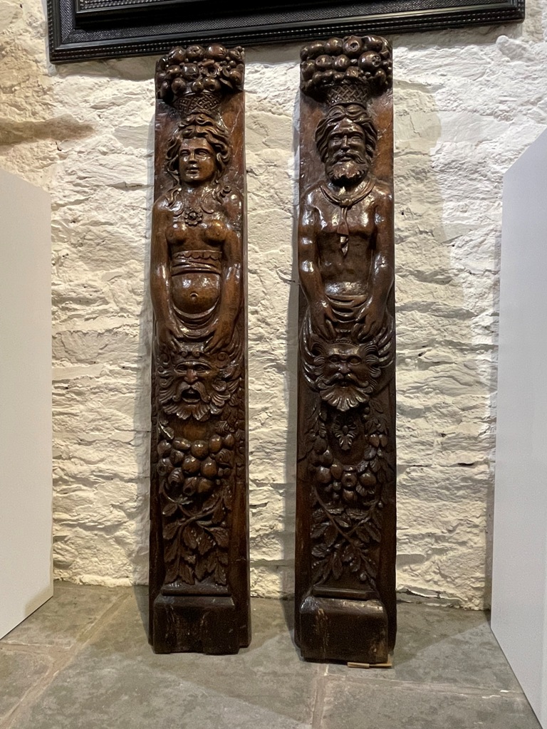 A MAGNIFICENT PAIR OF TUDOR OAK  FIGURAL TERMS.