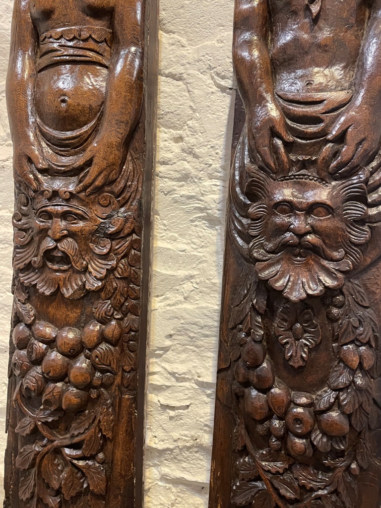 A MAGNIFICENT PAIR OF TUDOR OAK  FIGURAL TERMS.